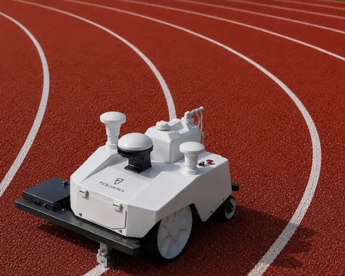 Autonomous GPS line-marking robot painting precise white lane lines on an outdoor athletics running track.